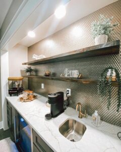 White quartz kitchen countertop with metallic tile penny backsplash