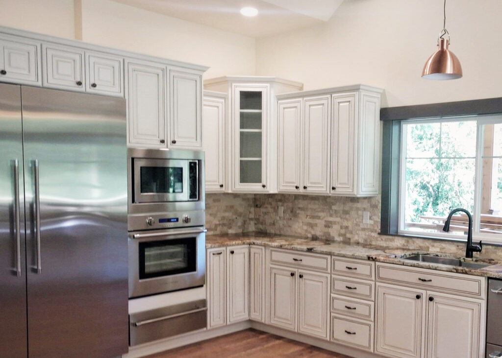Tops kitchen: granite countertop w/ white cabinets.