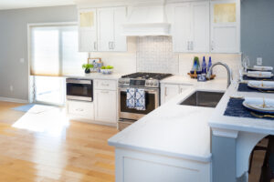 Modern kitchen countertops with white cabinetry.
